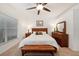 Spacious bedroom with a king-size bed and wood furniture at 10010 Bucklin St, Tampa, FL 33625