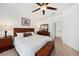 Main bedroom with king-size bed and ensuite bathroom access at 10010 Bucklin St, Tampa, FL 33625