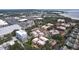 Aerial view of community featuring multiple buildings and a nearby shopping center at 1012 Pearce Dr # 211, Clearwater, FL 33764