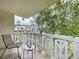 Private balcony with chairs and small table at 1012 Pearce Dr # 211, Clearwater, FL 33764