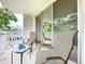 Private balcony with chairs and small table at 1012 Pearce Dr # 211, Clearwater, FL 33764