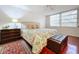 Peaceful bedroom with king-size bed and hardwood floors at 1012 Pearce Dr # 211, Clearwater, FL 33764