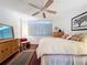 Comfortable bedroom with a king-size bed and wood floors at 1012 Pearce Dr # 211, Clearwater, FL 33764