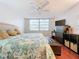 Bright bedroom with king-size bed and large windows at 1012 Pearce Dr # 211, Clearwater, FL 33764