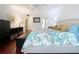 Bright bedroom with king-size bed and wood floors at 1012 Pearce Dr # 211, Clearwater, FL 33764