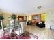 Spacious common area with seating and a glass dining table at 1012 Pearce Dr # 211, Clearwater, FL 33764