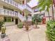 Lush courtyard with brick-paved seating area at 1012 Pearce Dr # 211, Clearwater, FL 33764