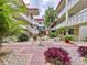 Landscaped courtyard with brick path and fountain at 1012 Pearce Dr # 211, Clearwater, FL 33764