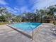 Community pool with ample deck space and lounge chairs at 1012 Pearce Dr # 211, Clearwater, FL 33764