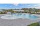 Resort-style pool with a playground and shaded seating at 10399 Gliding Eagle Way, Land O Lakes, FL 34638