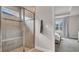 Large walk-in shower with built-in seat and window for natural light at 10399 Gliding Eagle Way, Land O Lakes, FL 34638