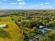 Beautiful aerial shot of lush land, mature trees, and road frontage at 10601 Paul S Buchman, Plant City, FL 33565