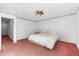 Neutral bedroom featuring a ceiling fan, and pink carpet at 10601 Paul S Buchman, Plant City, FL 33565