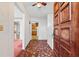 Inviting foyer featuring unique tile flooring and a solid wood front door, creating a warm welcome at 10601 Paul S Buchman, Plant City, FL 33565