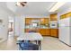 Classic eat-in kitchen featuring wooden cabinetry, tiled backsplash, and a vintage vibe at 10601 Paul S Buchman, Plant City, FL 33565