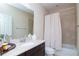 Clean bathroom with tub shower, vanity and toilet at 11125 Winthrop Lake Dr, Riverview, FL 33578