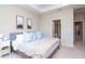 Spacious bedroom with large bed, ensuite bathroom access, and ample closet space at 11125 Winthrop Lake Dr, Riverview, FL 33578