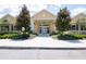 Community center entrance with landscaping and a paved walkway at 11125 Winthrop Lake Dr, Riverview, FL 33578