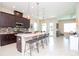 Open concept kitchen with breakfast bar and access to living room at 11125 Winthrop Lake Dr, Riverview, FL 33578