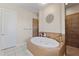 Bathroom with garden tub and walk-in shower at 11307 Wagon Trail Run, Lithia, FL 33547