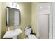 Bathroom with pedestal sink, toilet, and shower at 11307 Wagon Trail Run, Lithia, FL 33547