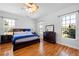 Main bedroom with hardwood floors and large windows at 11307 Wagon Trail Run, Lithia, FL 33547