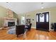 Living area with stone fireplace and hardwood floors at 11307 Wagon Trail Run, Lithia, FL 33547