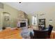 Living room with stone fireplace and hardwood floors at 11307 Wagon Trail Run, Lithia, FL 33547