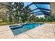 Spacious screened pool area with tile decking at 11307 Wagon Trail Run, Lithia, FL 33547