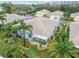 An aerial view of a house with a sunroom and a well-maintained backyard at 11447 Golf Round Dr, New Port Richey, FL 34654