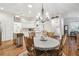 Bright dining room with hardwood floors and chandelier at 11447 Golf Round Dr, New Port Richey, FL 34654