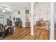 Open dining room with hardwood floors and chandelier at 11447 Golf Round Dr, New Port Richey, FL 34654