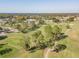 Aerial view of a lush green golf course at 11447 Golf Round Dr, New Port Richey, FL 34654