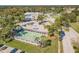 Community shuffleboard courts with covered areas and surrounding landscaping at 11447 Golf Round Dr, New Port Richey, FL 34654