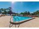 Inviting community swimming pool with lounge chairs at 11447 Golf Round Dr, New Port Richey, FL 34654