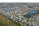 Aerial view of a residential community with houses, lakes, and green spaces at 11614 Brighton Knoll Loop, Riverview, FL 33579