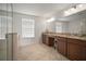 Bathroom boasts double vanity, granite countertop at 11614 Brighton Knoll Loop, Riverview, FL 33579