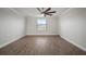 Bright bedroom with hardwood floors and ceiling fan at 11614 Brighton Knoll Loop, Riverview, FL 33579