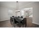 Elegant dining room with a large table and modern chandelier at 11614 Brighton Knoll Loop, Riverview, FL 33579