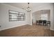 Elegant dining area with hardwood floors and a statement mirror at 11614 Brighton Knoll Loop, Riverview, FL 33579