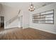 Open dining room with hardwood floors and a stylish chandelier at 11614 Brighton Knoll Loop, Riverview, FL 33579