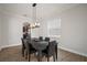 Modern dining room with hardwood floors and a chandelier at 11614 Brighton Knoll Loop, Riverview, FL 33579