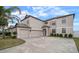 Two-story house with a three-car garage at 11614 Brighton Knoll Loop, Riverview, FL 33579