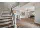 Modern staircase with metal railings and white risers at 11614 Brighton Knoll Loop, Riverview, FL 33579