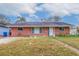 Brick ranch home with a landscaped yard at 120 80Th N Ave, St Petersburg, FL 33702