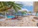 Screened pool with patio and tropical plants at 120 80Th N Ave, St Petersburg, FL 33702