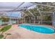 Screened-in kidney shaped pool and patio at 120 80Th N Ave, St Petersburg, FL 33702