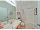 Clean bathroom with a tub, shower, and updated vanity at 12127 Luftburrow Ln, Hudson, FL 34669