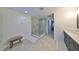 Spa-like bathroom featuring a large walk-in shower and bench at 12127 Luftburrow Ln, Hudson, FL 34669