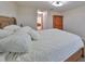 Spacious bedroom with a wooden armoire and plush bedding at 12127 Luftburrow Ln, Hudson, FL 34669